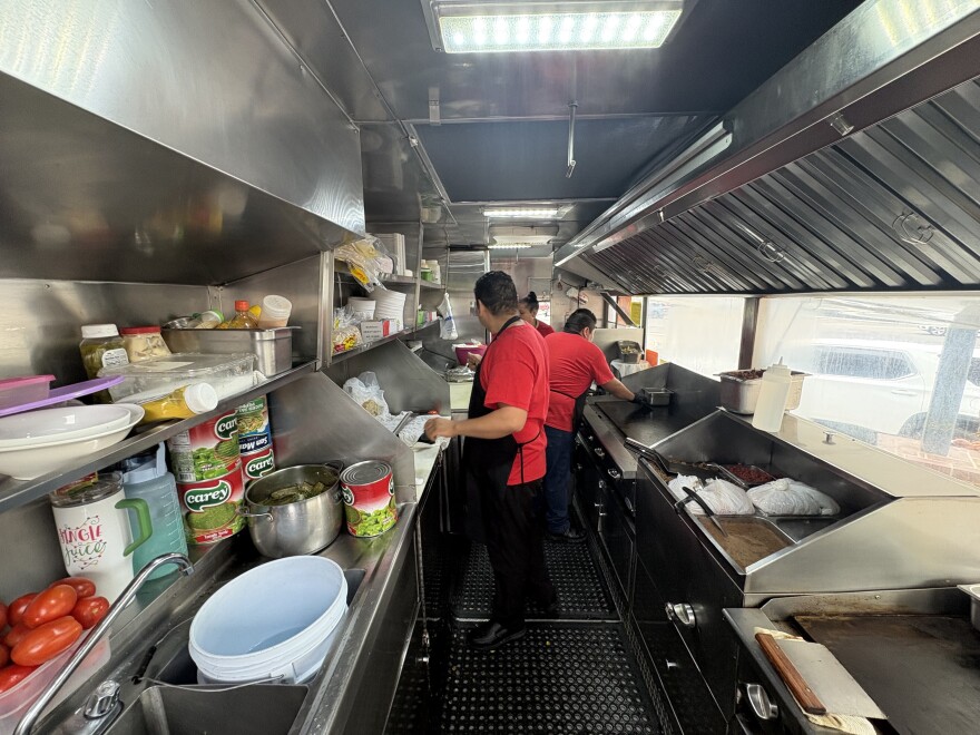 Workers inside the taco truck begin early, preparing for the lunch crowd starting at 9:30 a.m. on March 31, 2026.