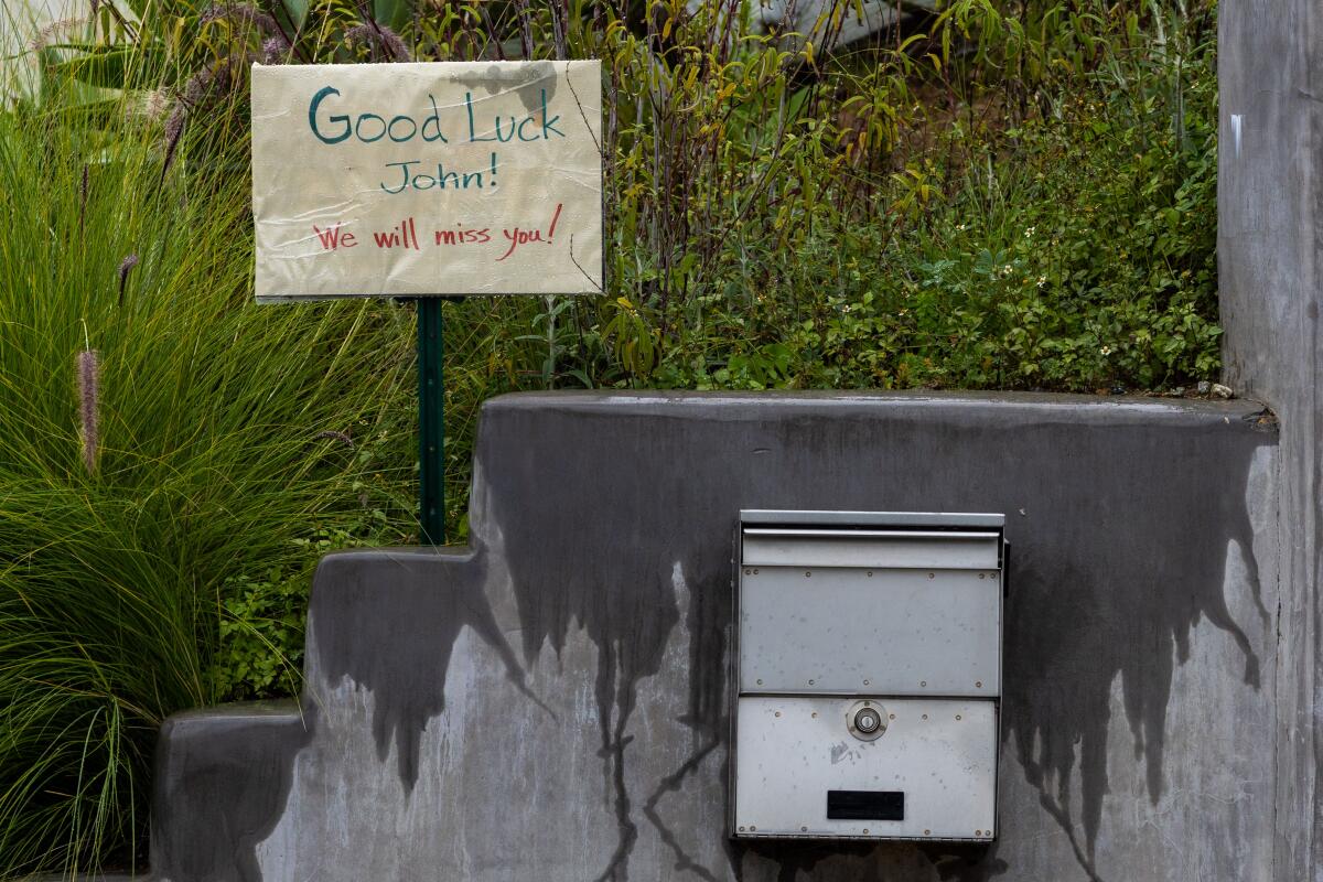 A good bye sign is out on USPS postal carrier John Ayala mailing route.