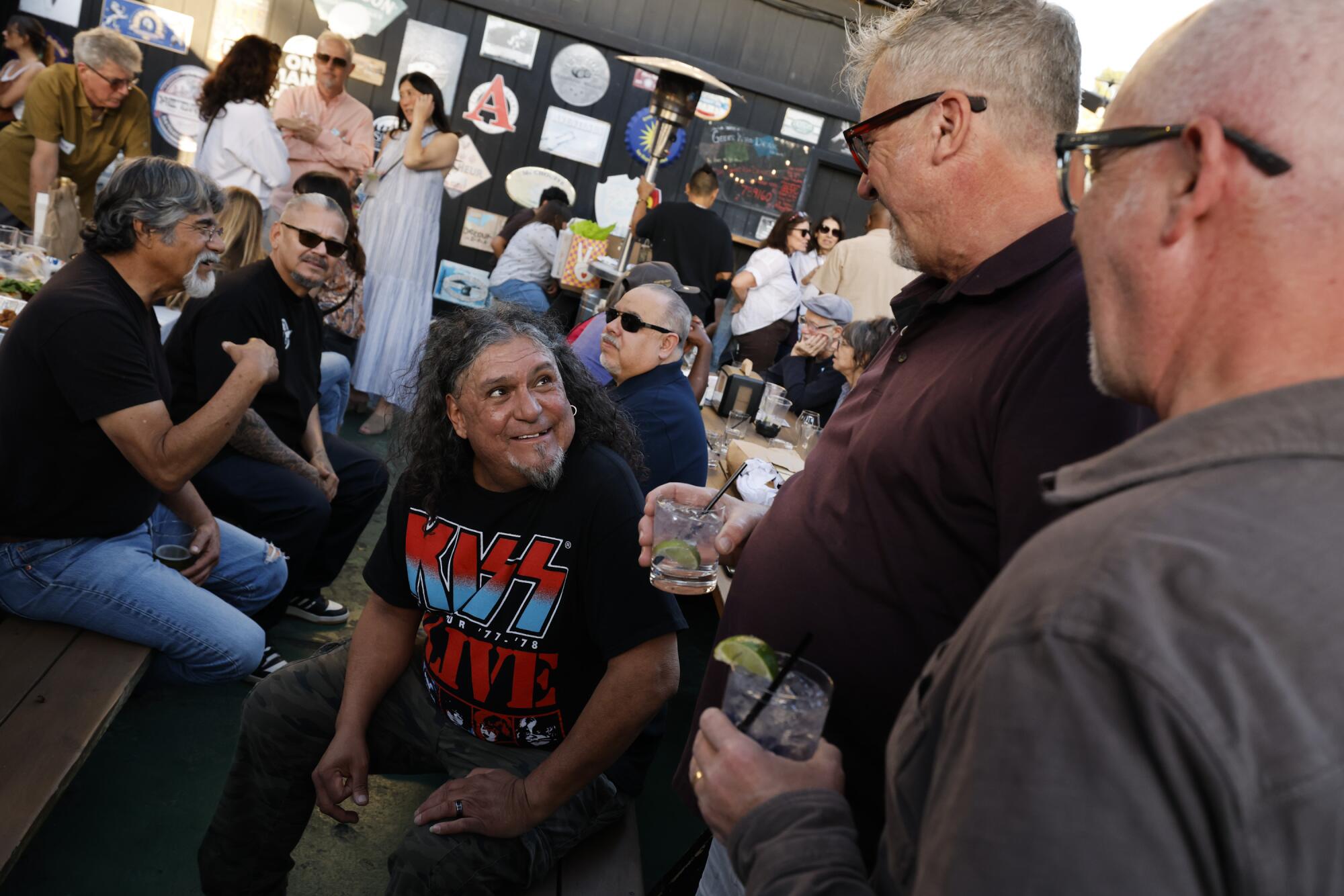 John Ayala (center) celebrates with friends at his retirement party.