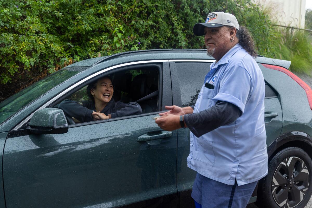 Los Angeles resident Seonna Hong stops on the road to thank Ayala.