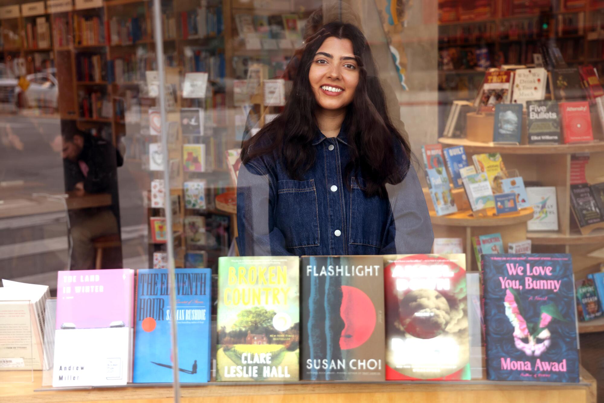 Allison Ambili Kumar, who coordinates book crawls across L.A., stands inside Village Well Books & Coffee in Culver City
