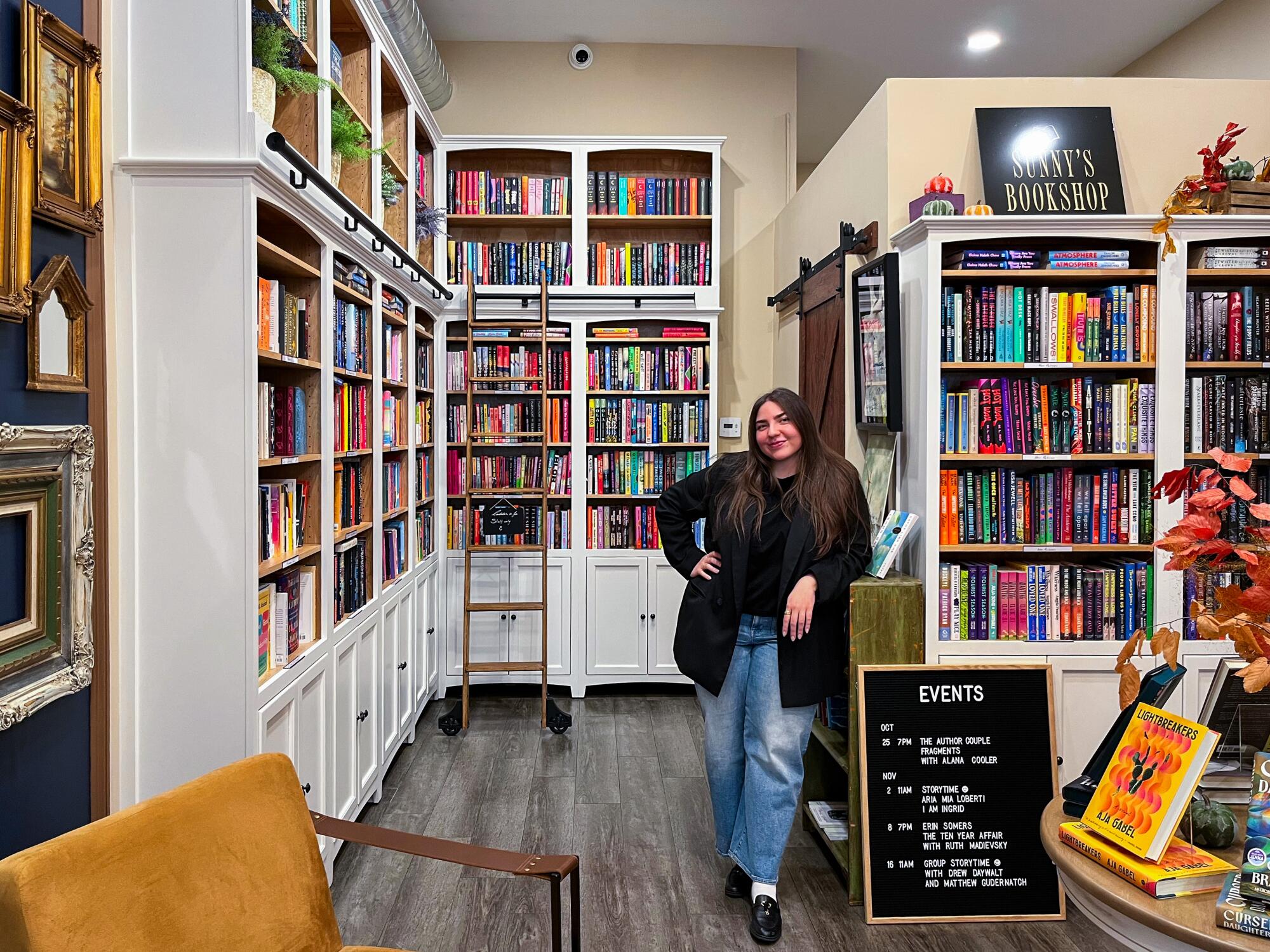 Sunny's Bookshop owner Sanaz Tamjidi poses at her Tarzana bookstore
