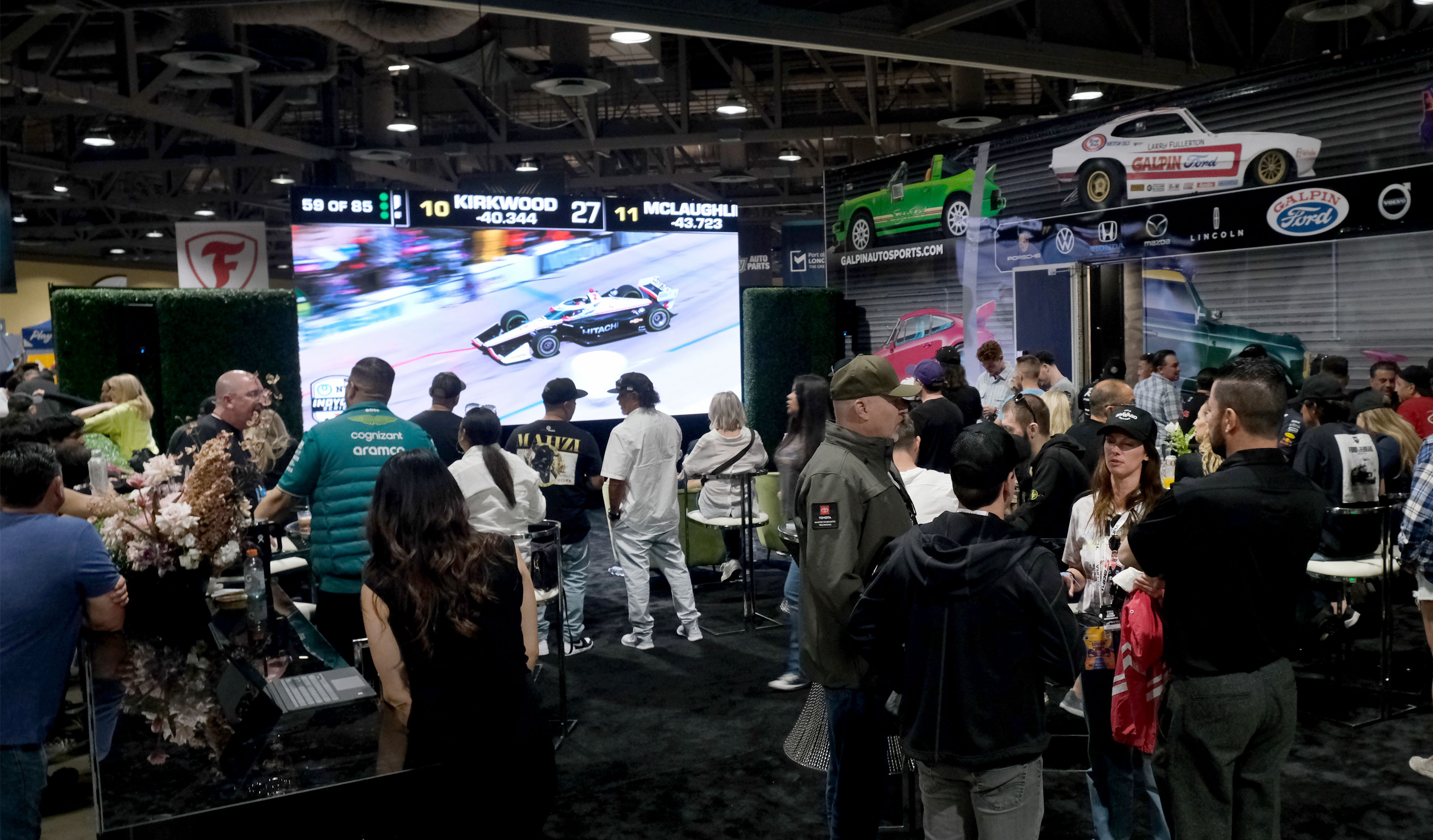 Fans watch the race from Galpin’s Classic Car Lounge in...