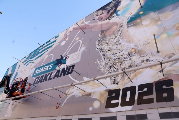 Artist Julie Engelmann, of Half Moon Bay, works on her mural of Olympic gold medal figure skaters Alysa Liu and Kristi Yamaguchi at the Oakland Ice Centerin Oakland, Calif., on Tuesday, April 7, 2026. Engelmann has worked on the mural since late March and it will be done this week. (Jane Tyska/Bay Area News Group)