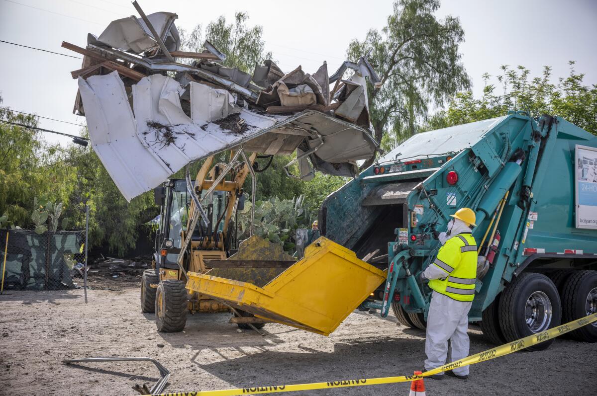 Large items are removed from a homeless encampment in North Hollywood.
