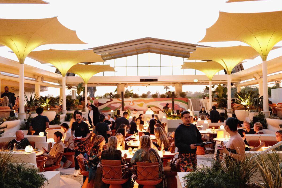 Guests dine at rooftop bar and restaurant Sushi Samba in West Hollywood