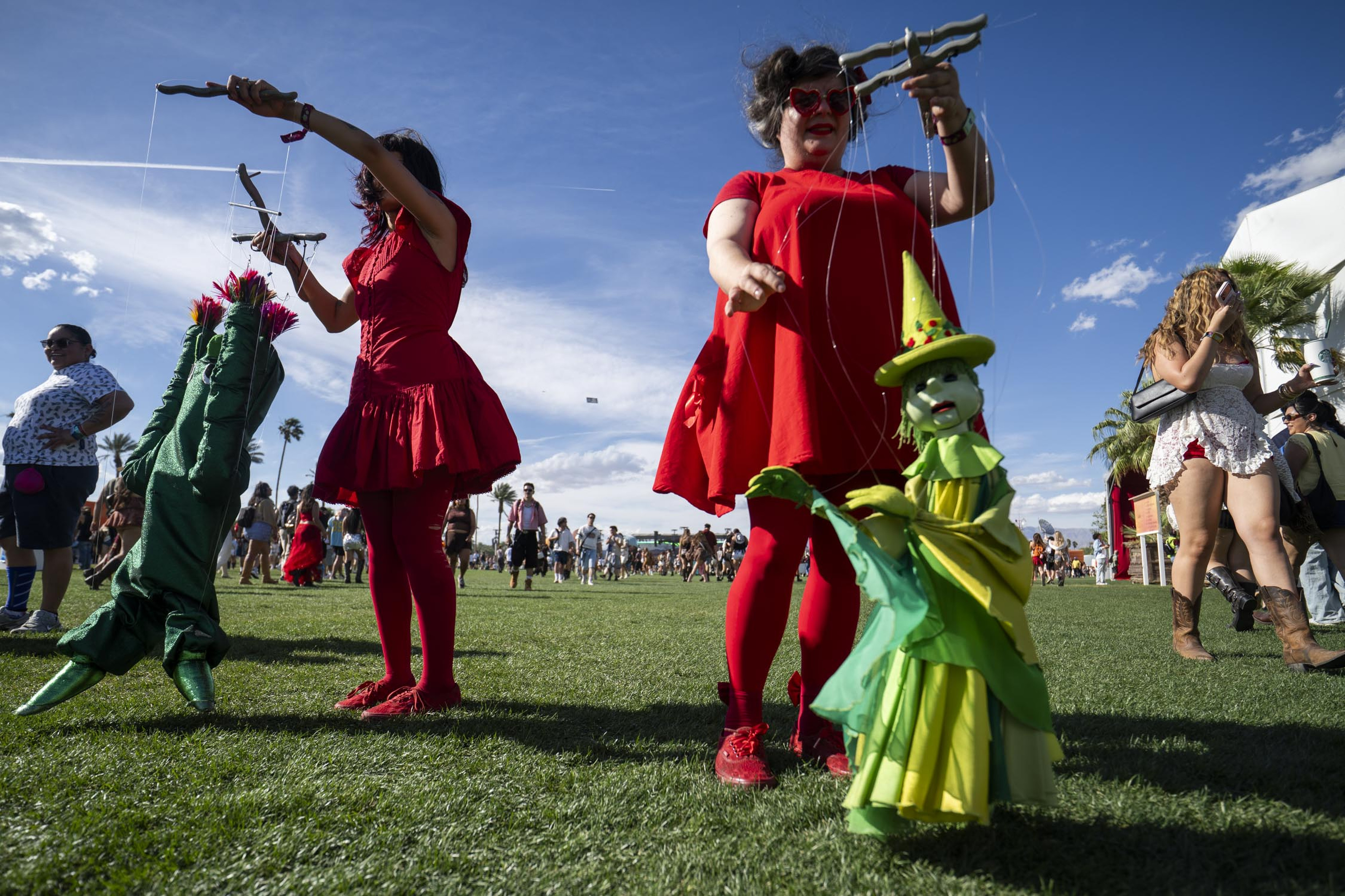 Performers from the Bob Baker Marionette Theater interact with attendees...