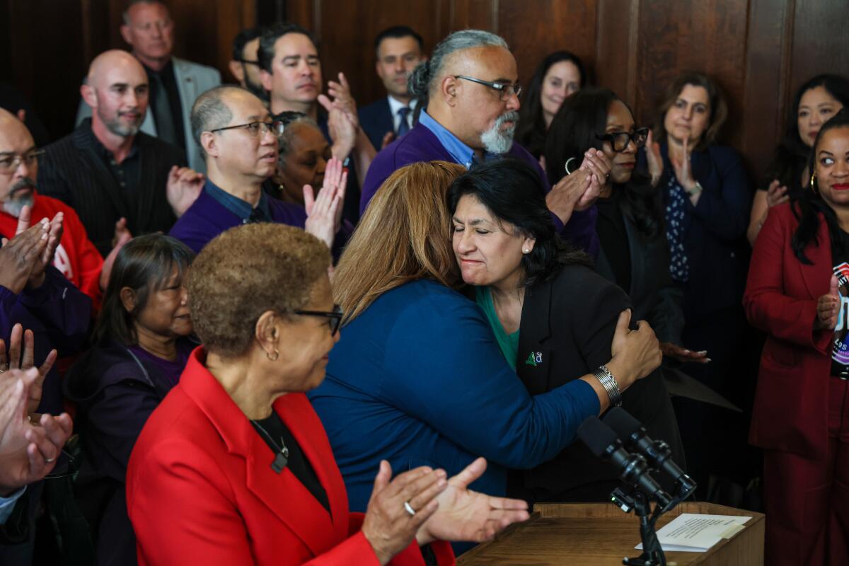 AALA /Teamsters 2010 President Maria Nichols hugs UTLA President Cecily Myart-Cruz