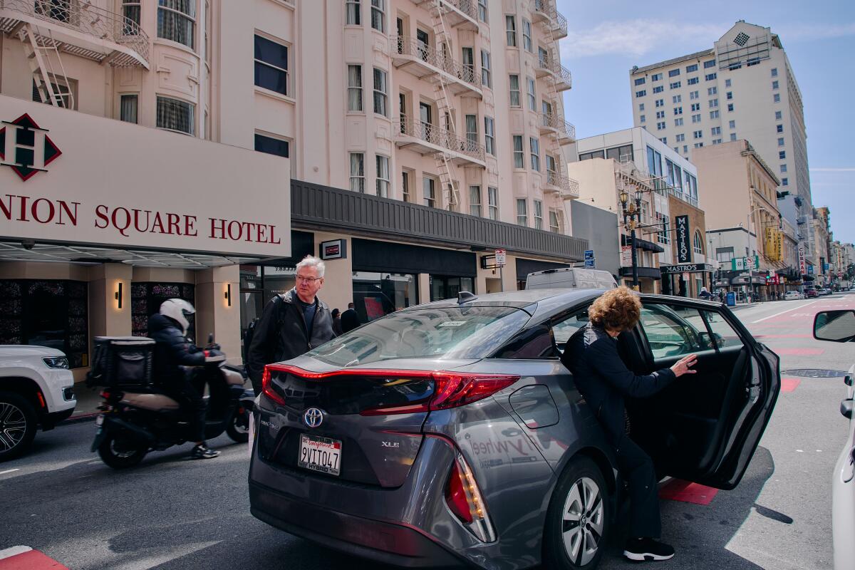 Guests at The Westin St. Francis hotel get into an Uber.
