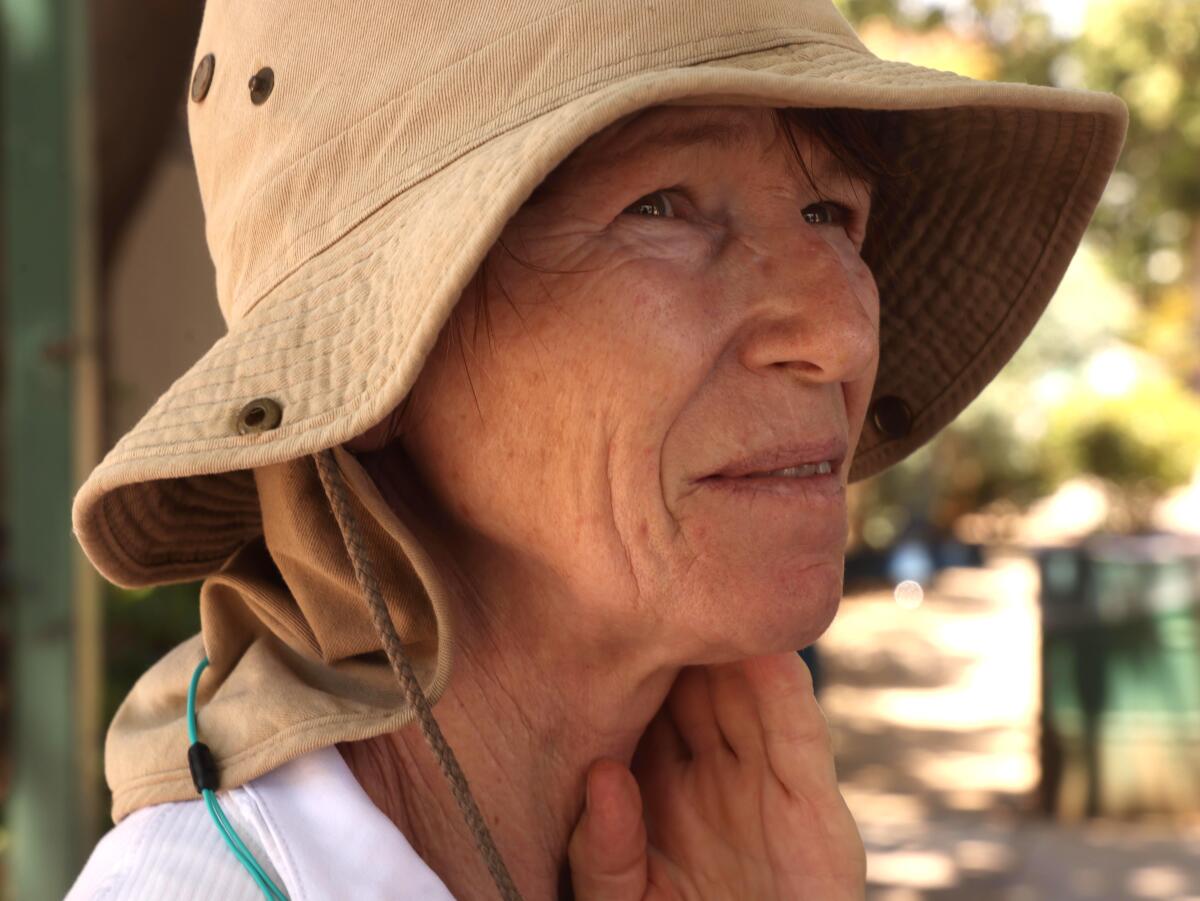 Sabine Phillips takes a break from documenting addresses of abandoned furniture and debris.