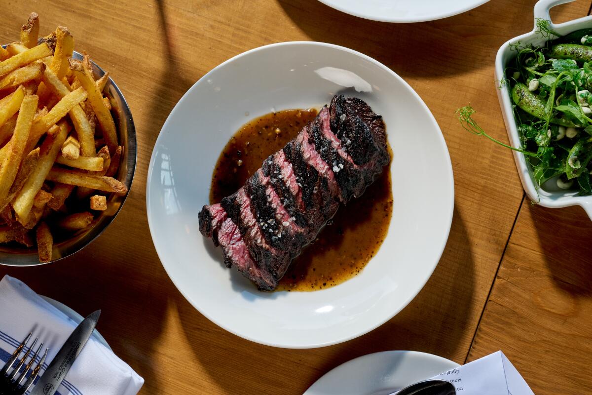 Electric Bleu's steak au poivre with a side of fries sprinkled with "electric" salt.