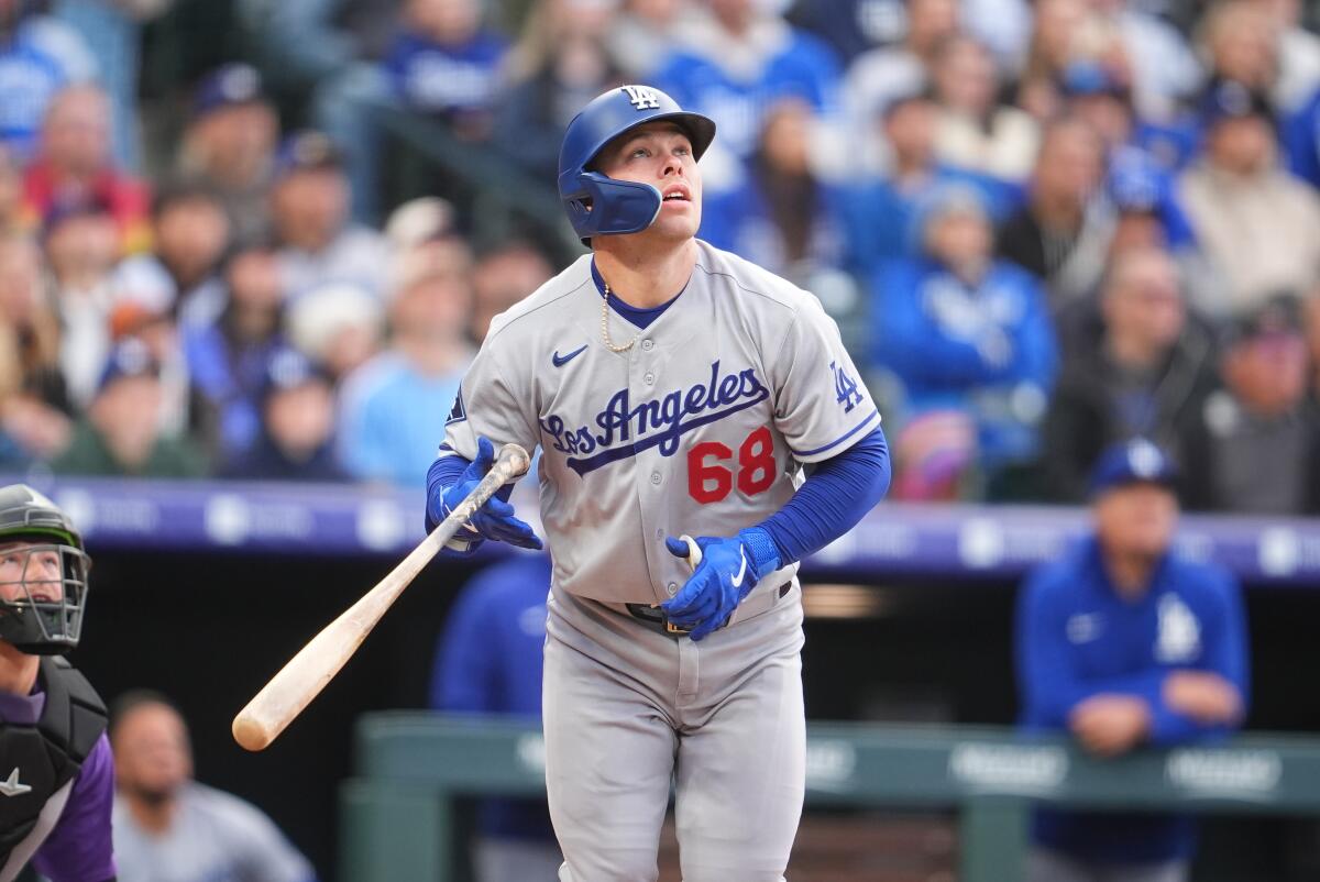 Dodgers catcher Dalton Rushing follows the flight of his solo home run off Colorado pitcher Ryan Feltner Saturday.