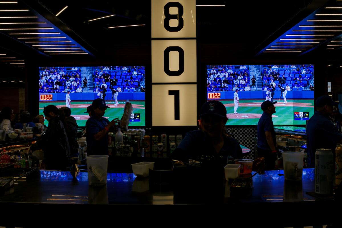 Fans can watch large screens live at an open bar area.