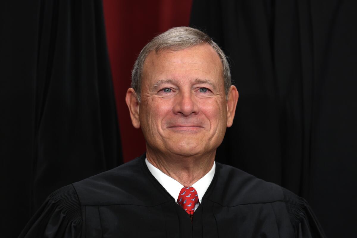 Chief Justice John Roberts poses for an official portrait at the Supreme Court building in 2022.