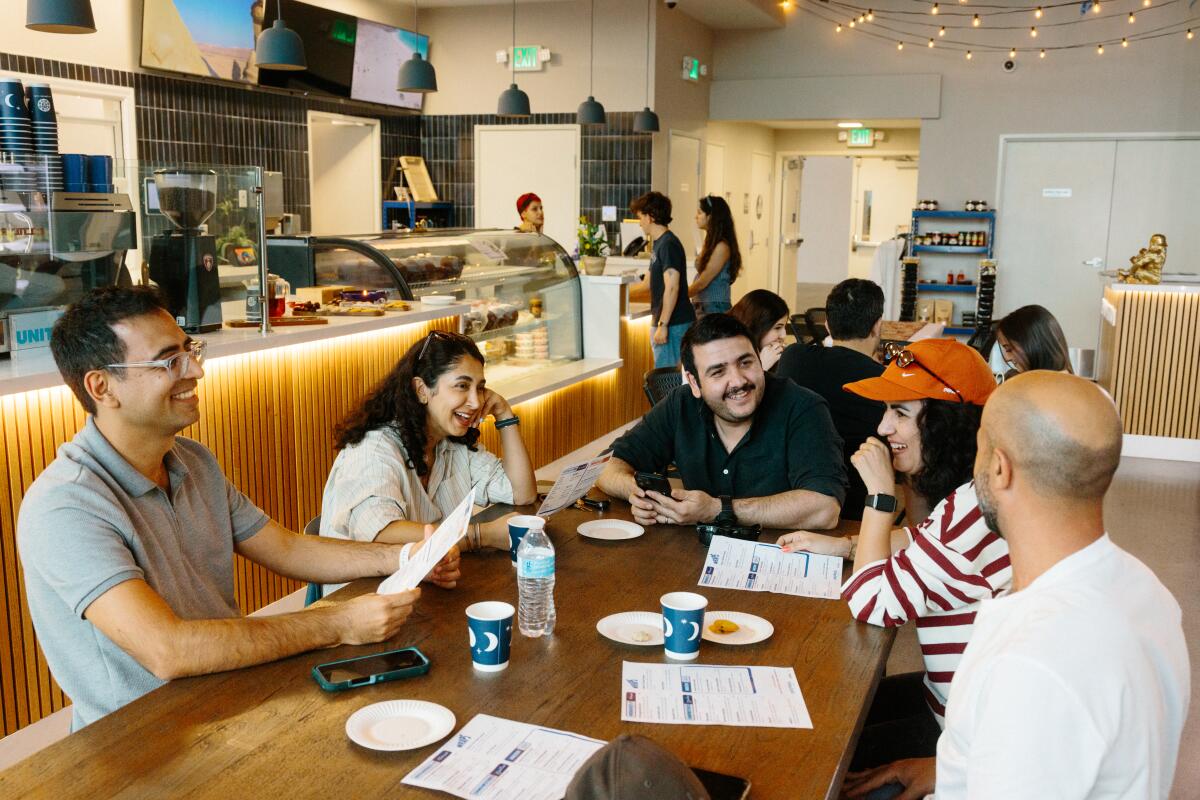 People gather for dinner at Meymuni Cafe in Los Angeles, CA on Saturday, March 7, 2026.