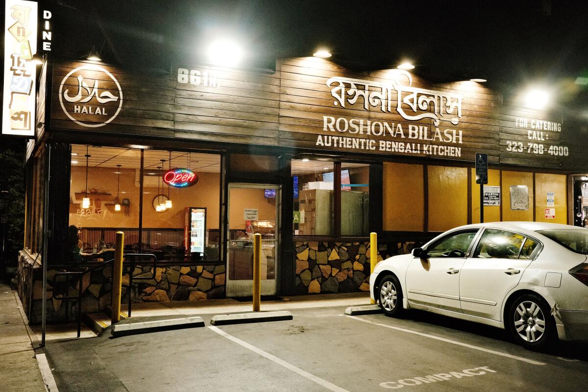An exterior of the wood-accented Bengali restaurant Roshana Bilash in Melrose Hill.
