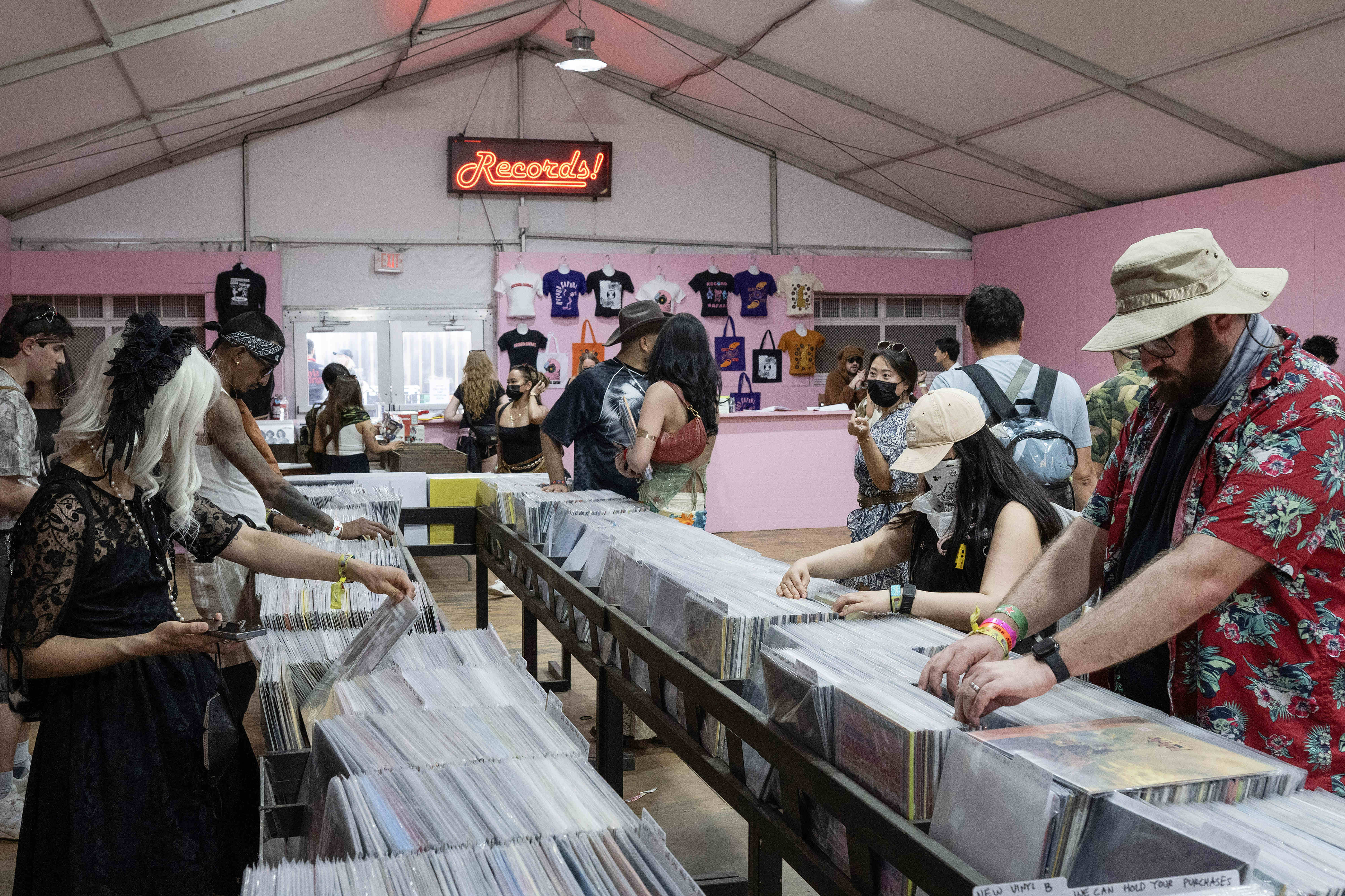 Festival goers shop for vinyl records inside Record Safari during...