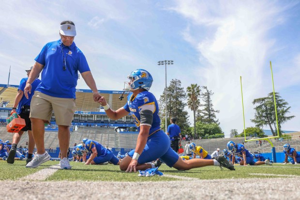 San Jose State Spartans head coach Ken Niumatalolo fist-pumps Kamaehu Kopa-Kaawalauole (83) during the San Jose State Spartans spring football showcase at CEFCU Stadium in San Jose, Calif., Saturday, April 18, 2026. (Ray Chavez/Bay Area News Group)