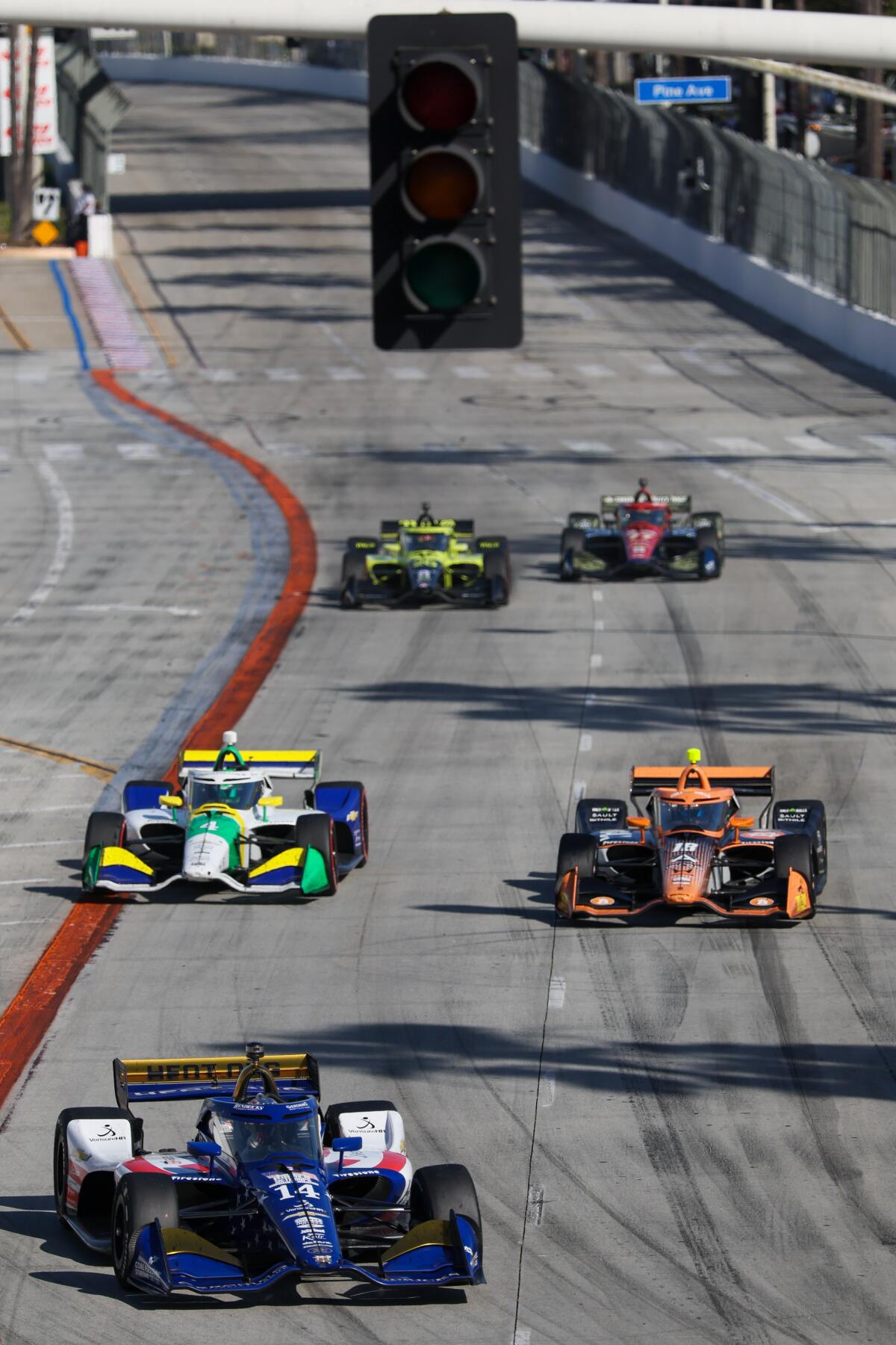 Cars make their way down a straightaway during Long Beach Grand Prix.