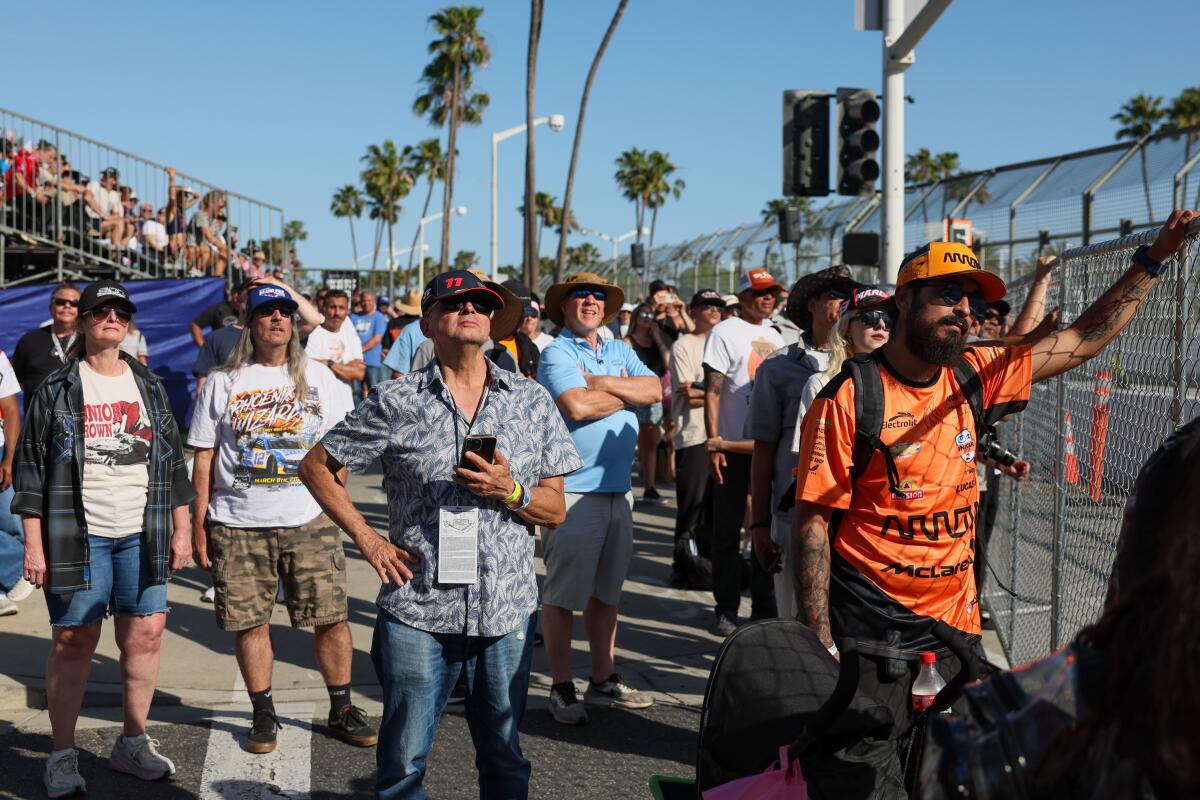 Fans watch with two laps left in the race.