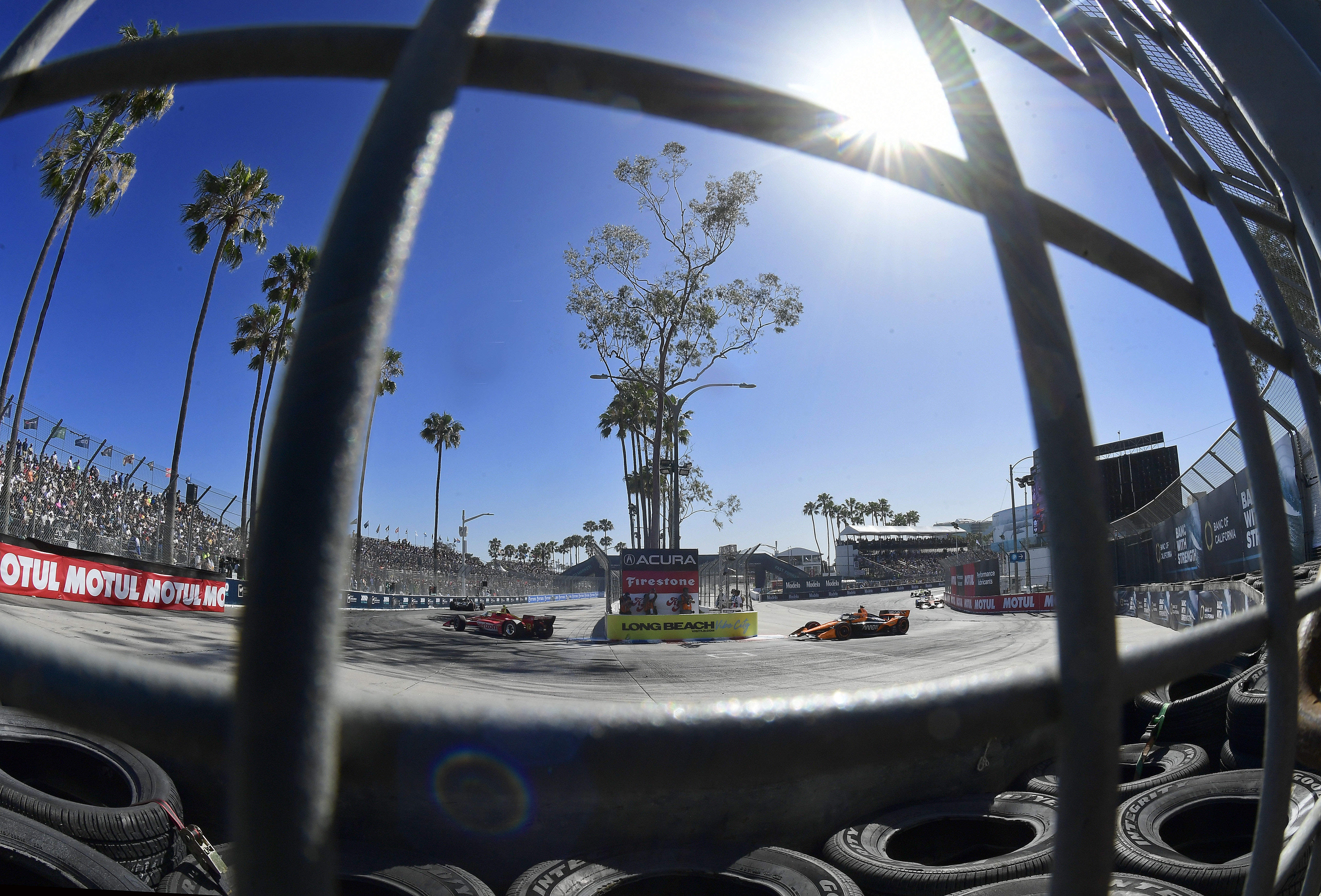 Indycars race through the hairpin onto Shoreline Drive during the...