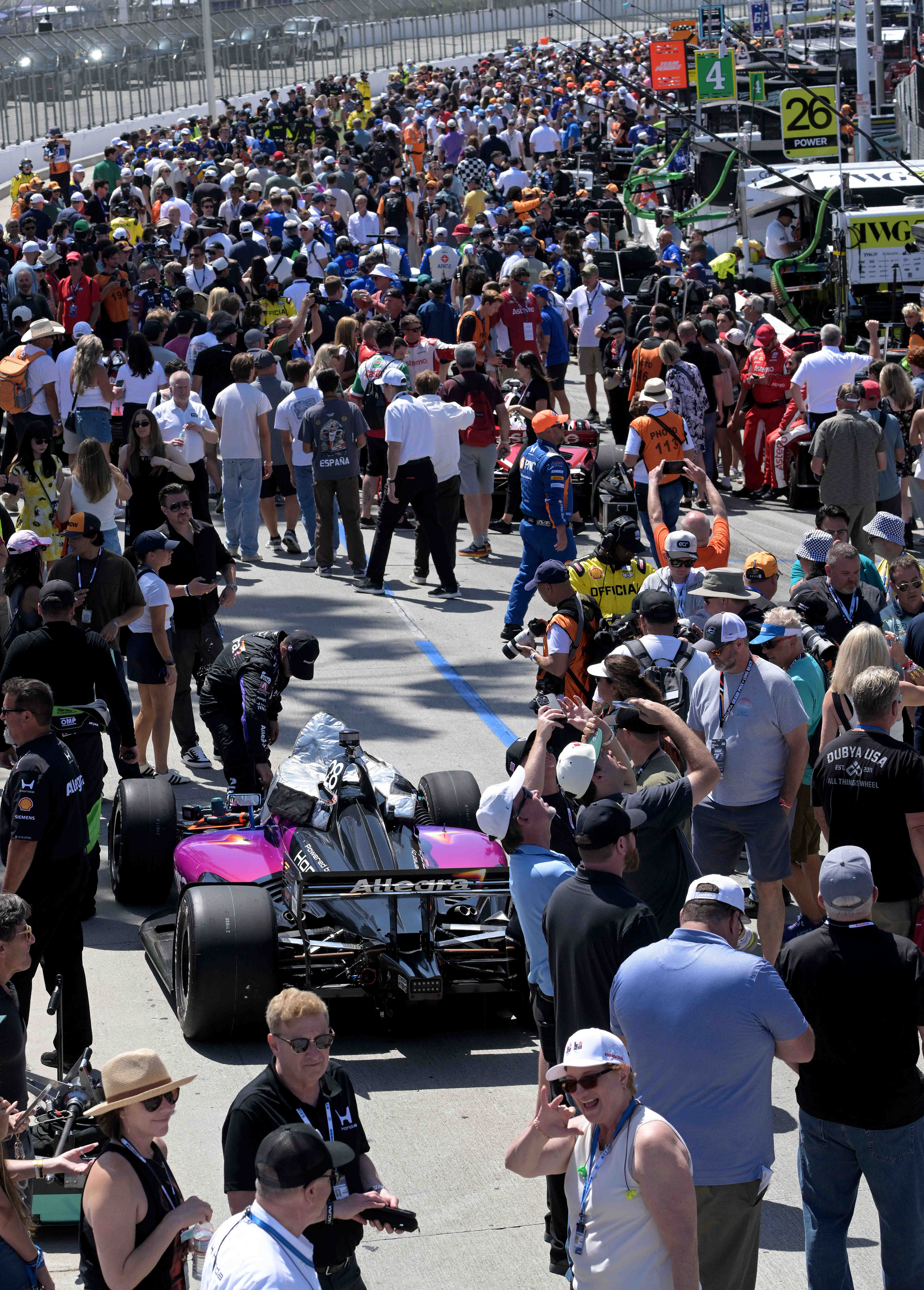 Race fans jam the pit lane prior to the 51st...
