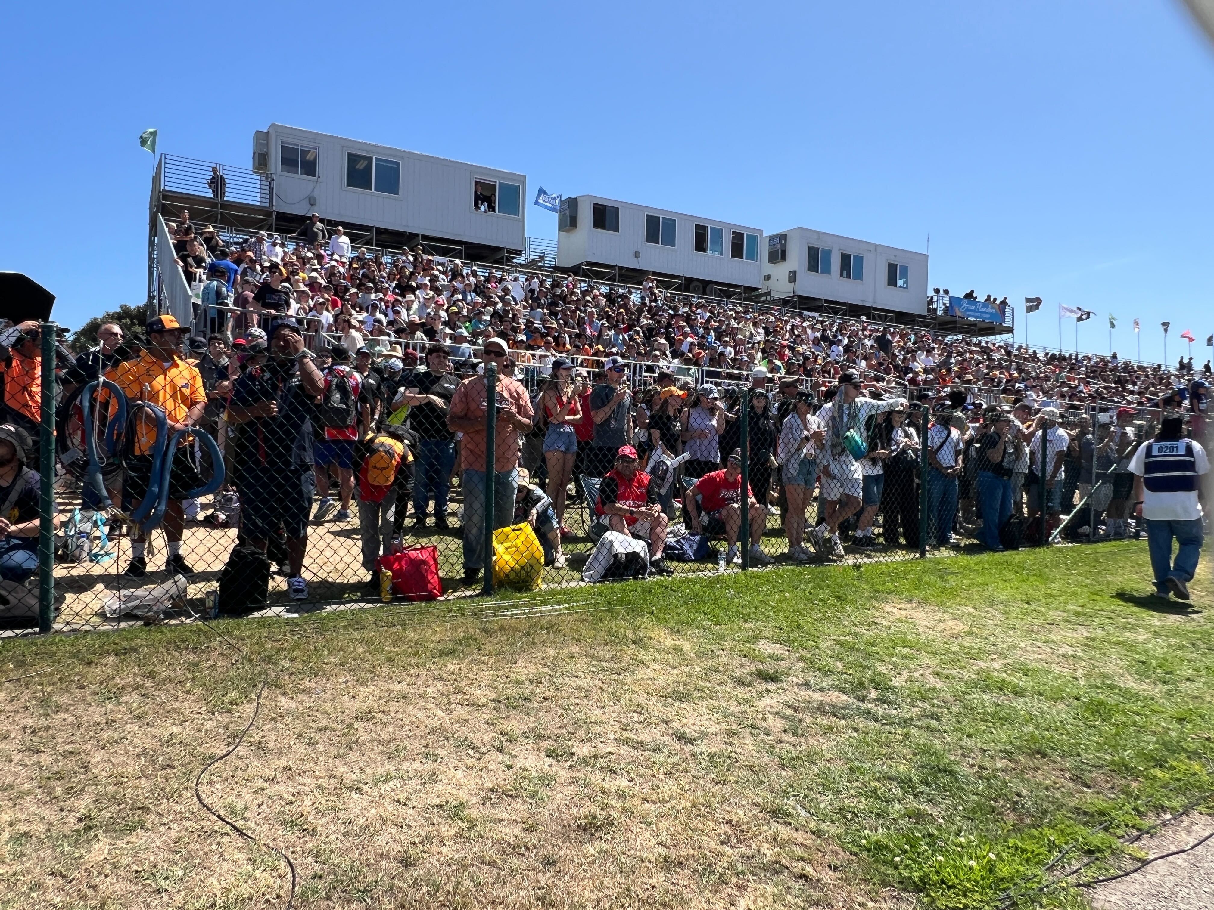 The grandstands fill up about half an hour before the...