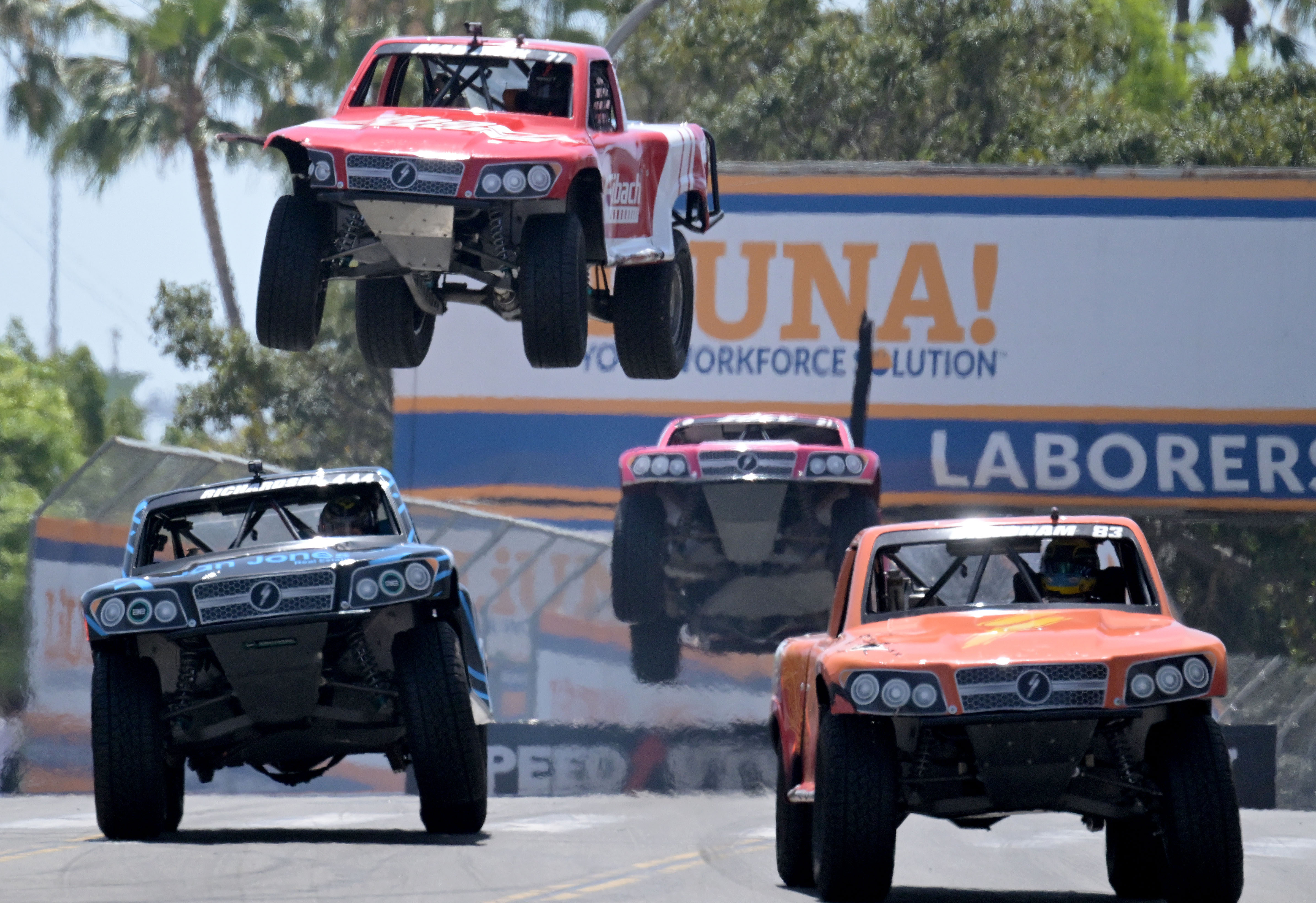 Stadium Super Truck drivers Matt Brabham, front right, Shaun Richardson,...