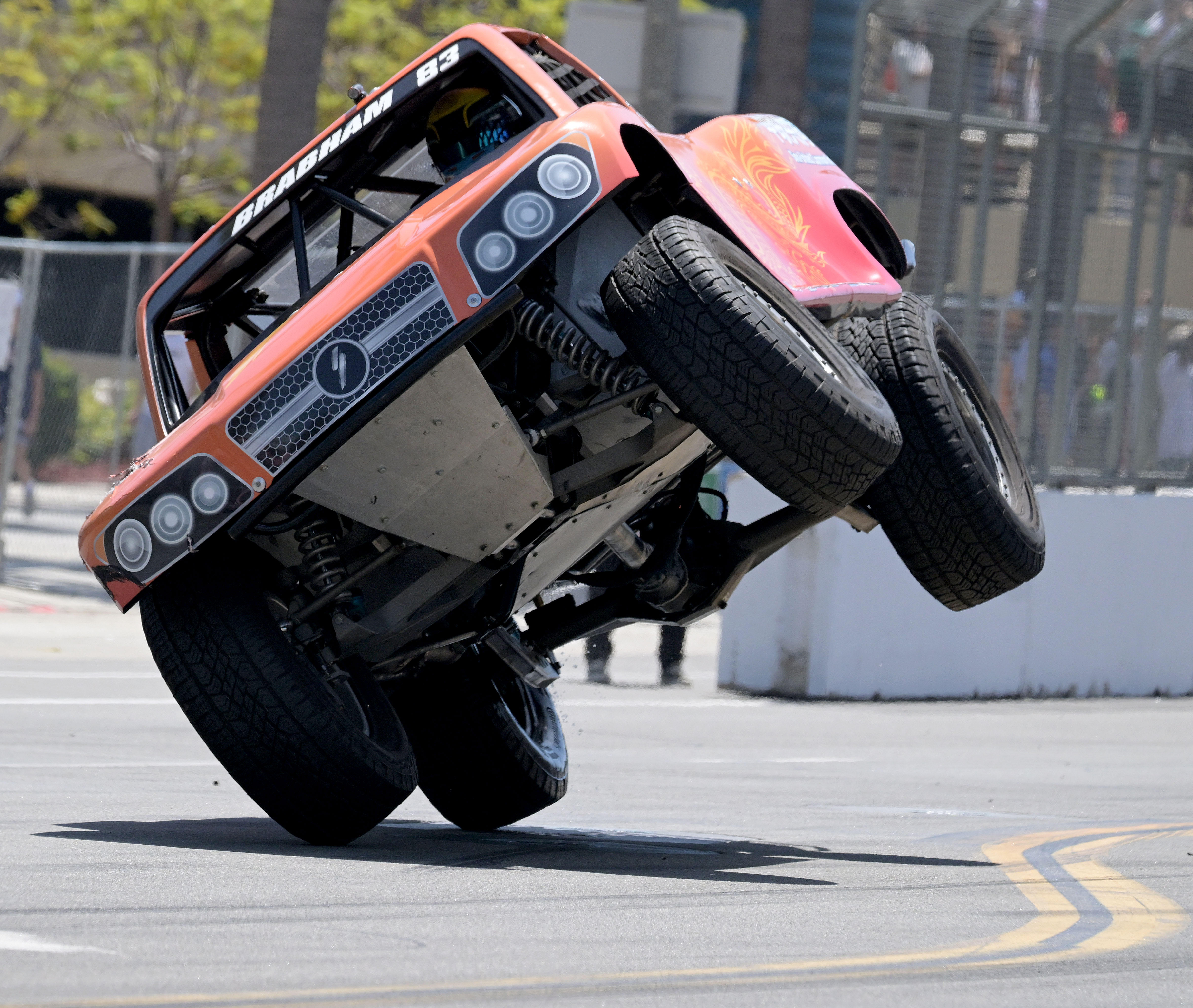 Stadium Super Trucks race winner Matt Brabham gets up on...