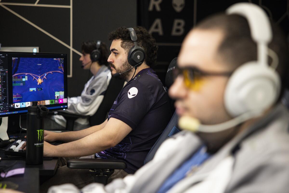 Three esports players compete in "World of Warcraft."