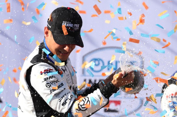 Indycar driver Alex Palou sprays champagne after winning the 51st Grand Prix of Long Beach in Long Beach on Sunday, April 19, 2026. (Photo by Trevor Stamp, Contributing Photographer)