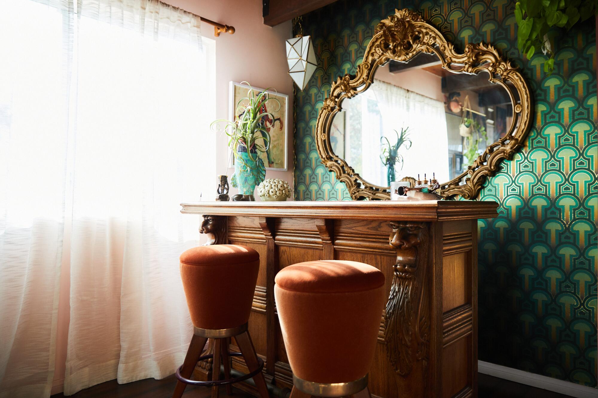 A colorful lounge with green wallpaper.