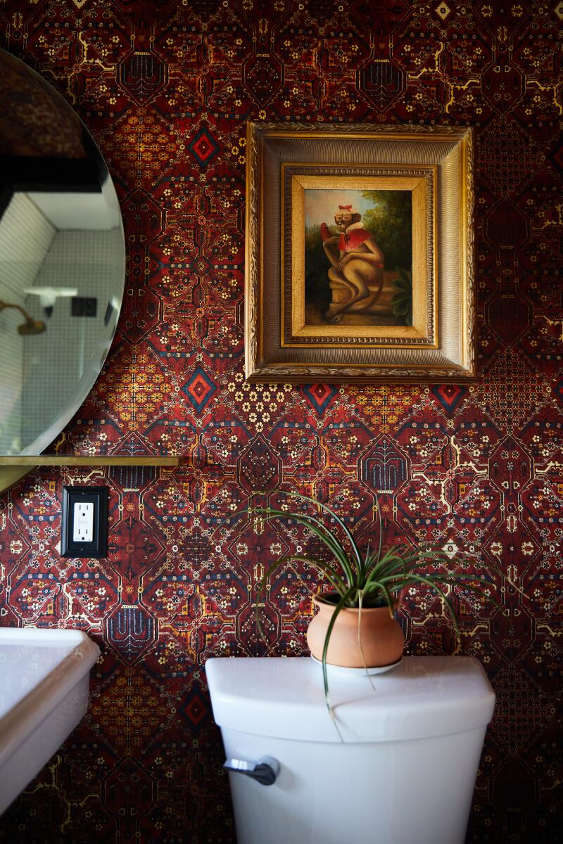 A bathroom with perisan rug print wallpaper 