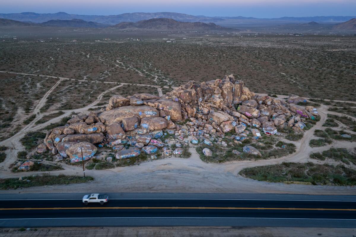 An aerial view of boulders covered in graffiti, at the location where Lorraine Bird's body was found.