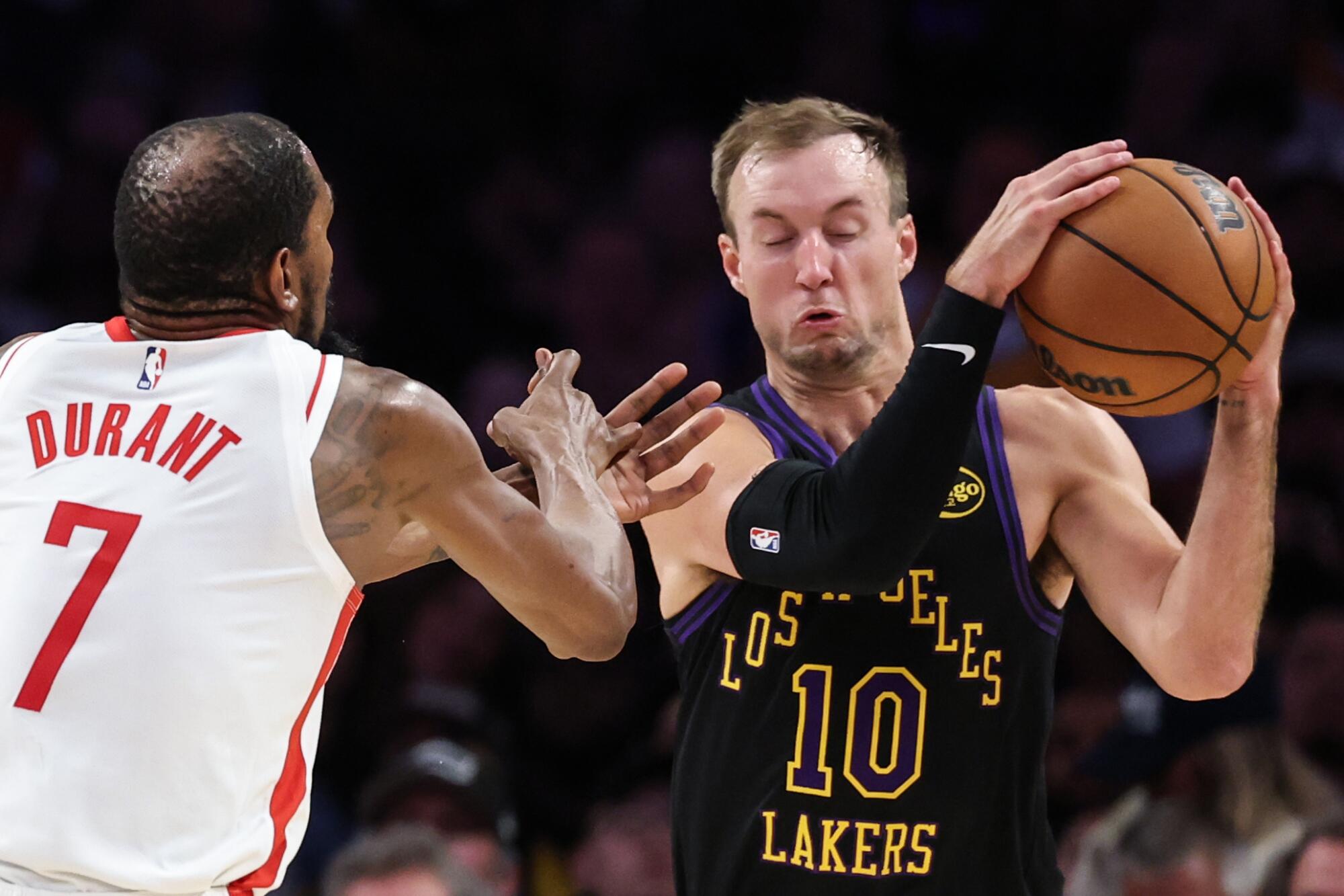 Lakers guard Luke Kennard takes the ball from Rockets forward Kevin Durant during Game 2.