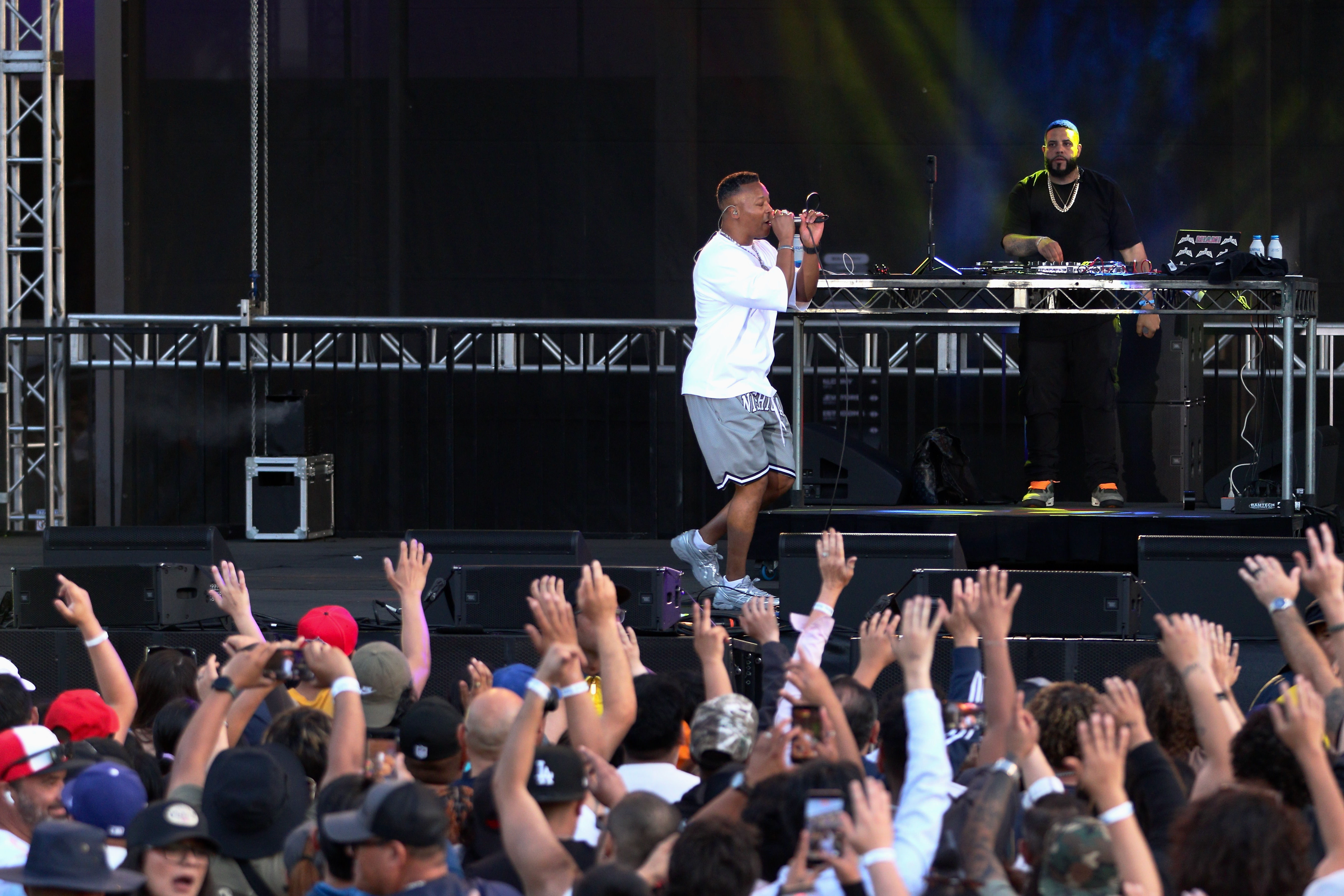 Rapper Lupe Fiasco is backed by DJ Smokey at the...