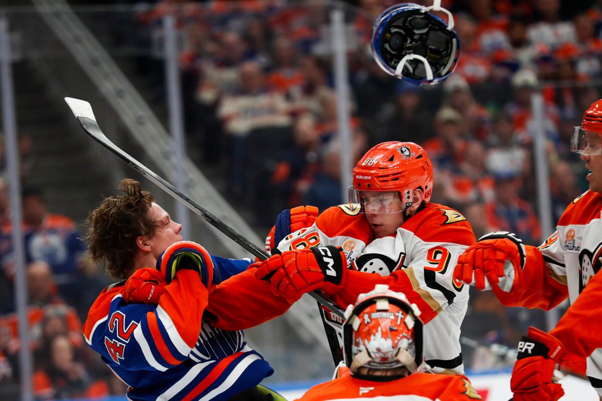 Pavel Mintyukov, right, of the Ducks battles against Kasperi Kapanen of the Oilers in the second period.