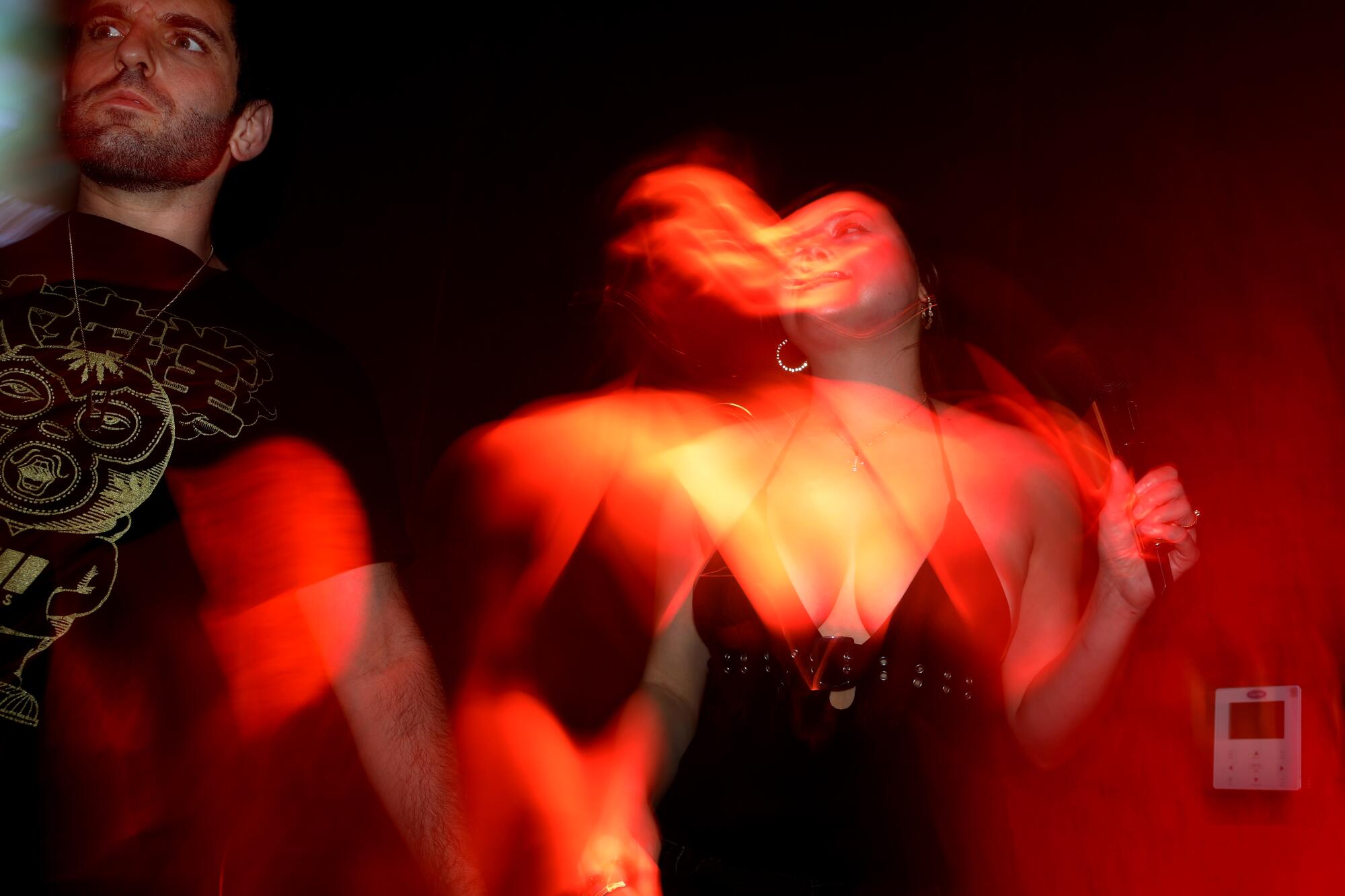 Harrison Baum, left, of Santa Monica, and Amanda Stagner, 27, of Los Angeles, sing in one of the 13 private karaoke rooms.