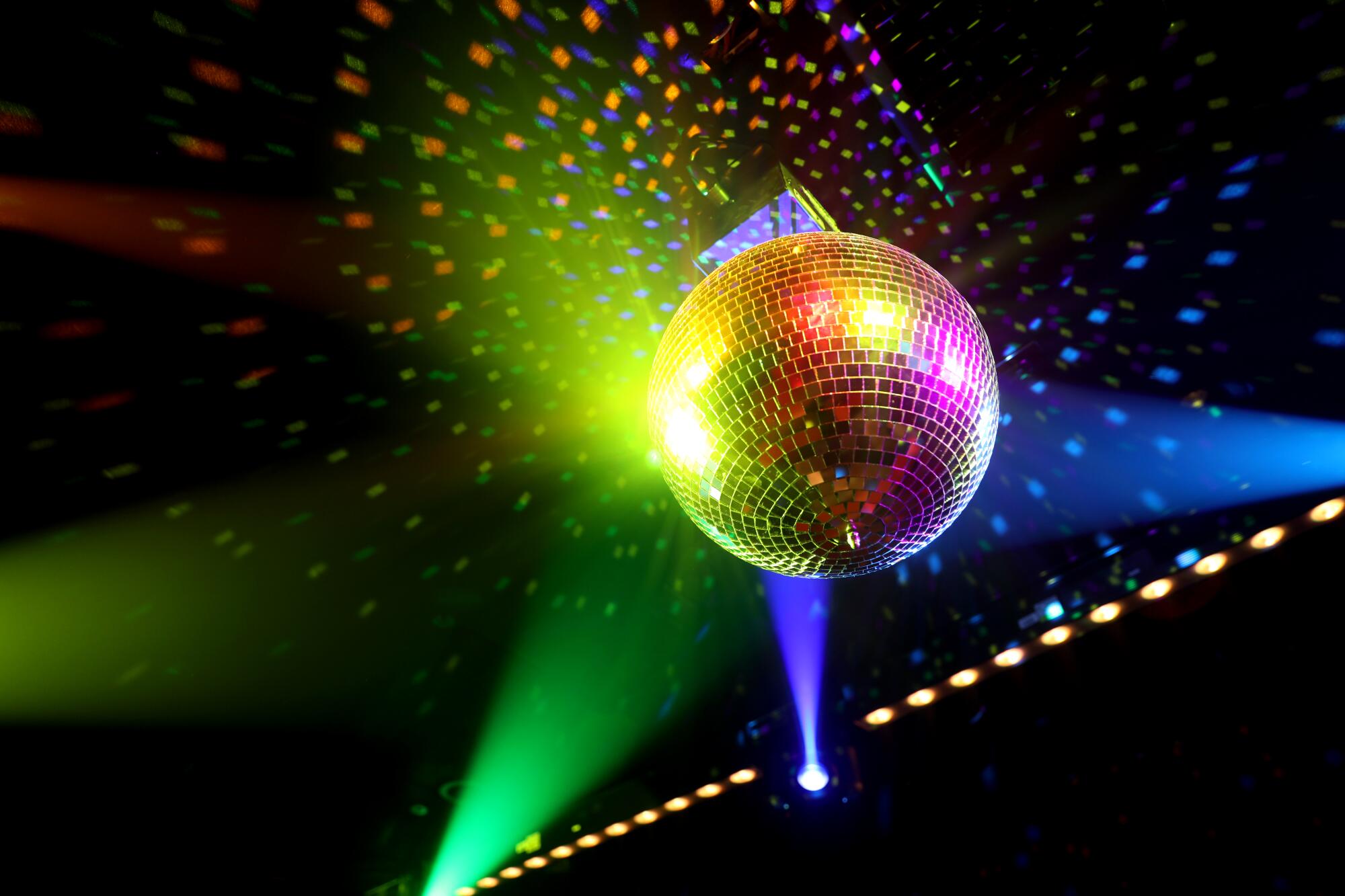 A disco ball hangs from the ceiling.