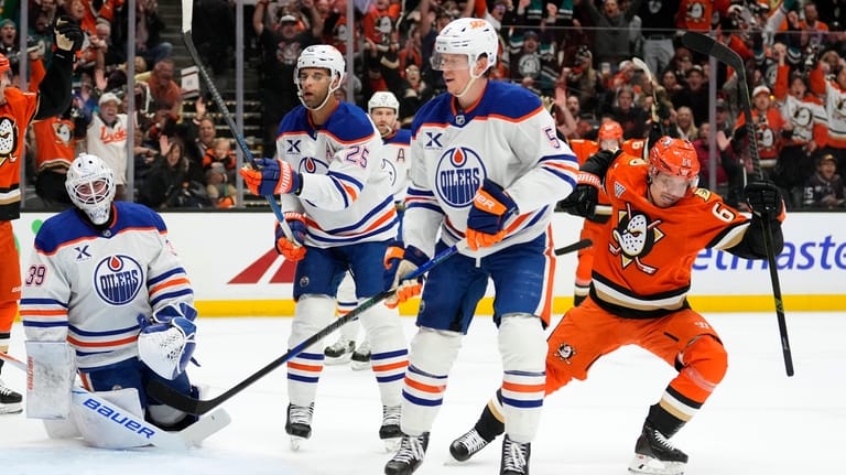 Anaheim Ducks center Mikael Granlund, right, celebrates his goal as...