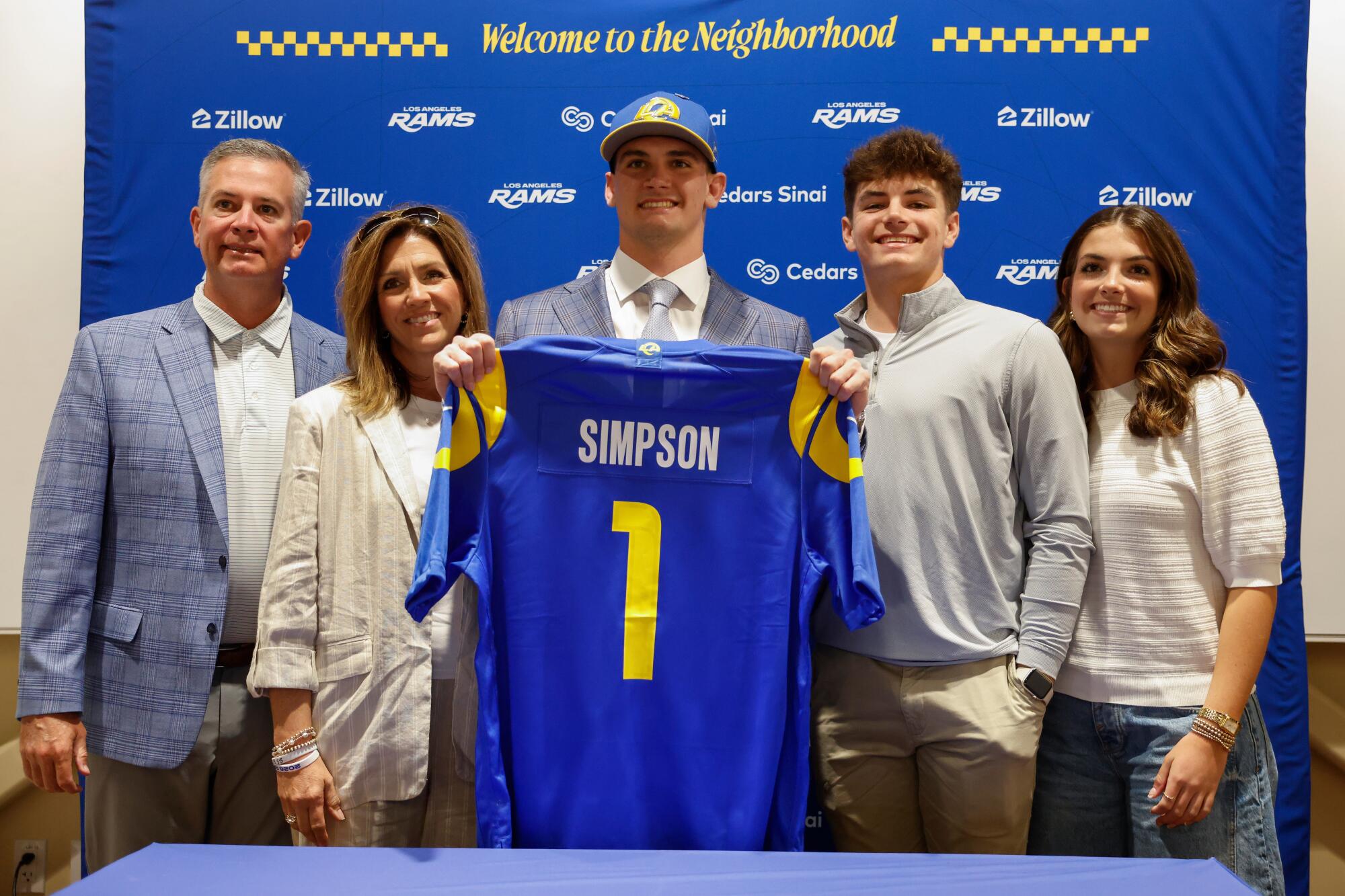 Ty Simpson poses for a photo with his family during a news conference in Inglewood on Friday.