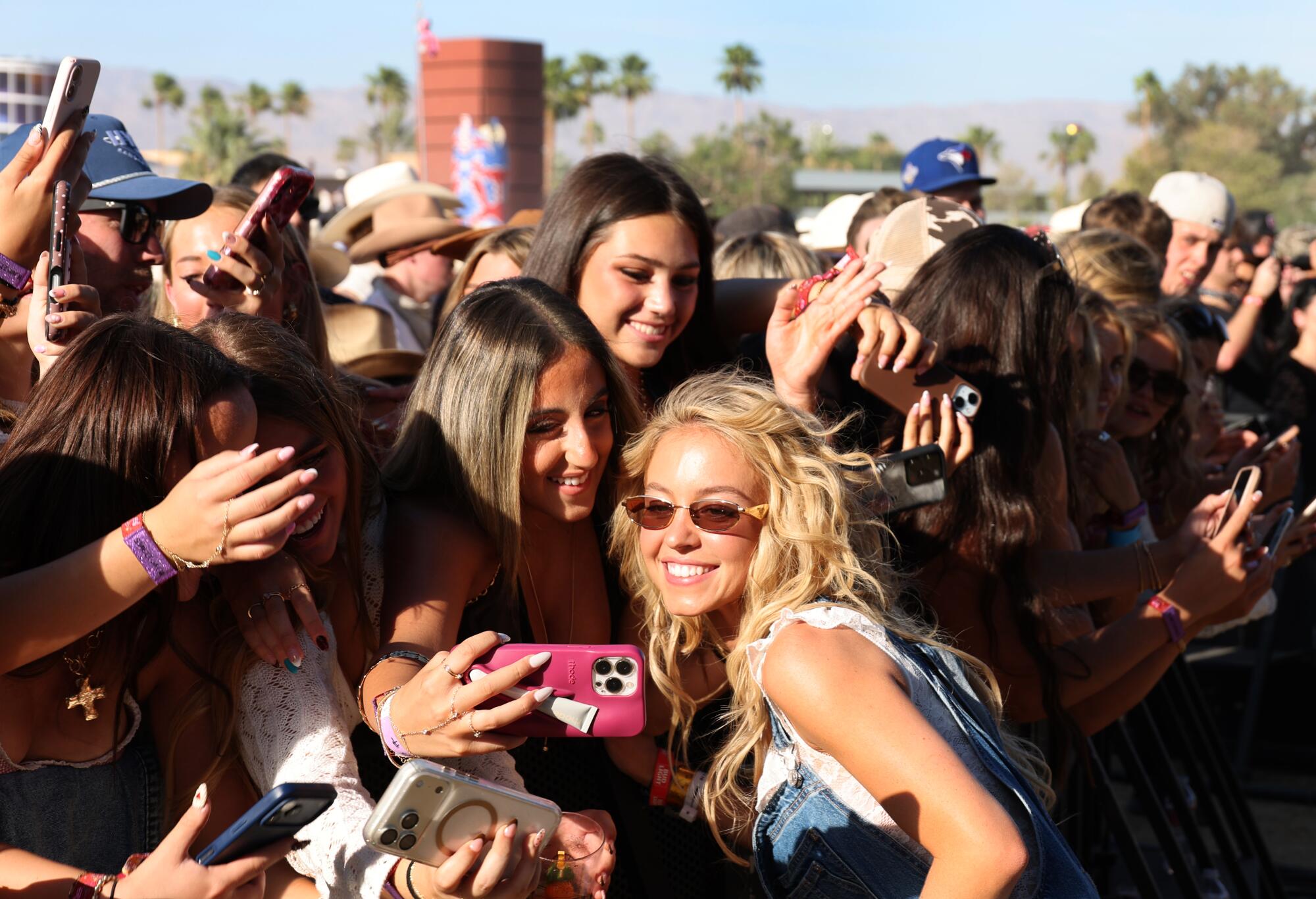 Actress Sydney Sweeney takes photos with fans at Stagecoach