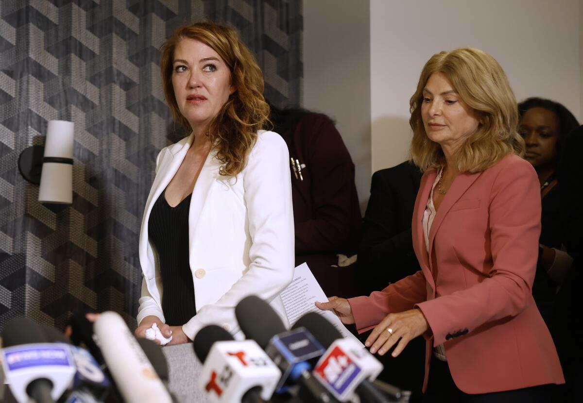 Lonna Drewes, left, and her attorney, Lisa Bloom, arrive at a press conference