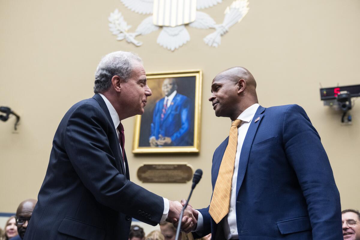 two men shake hands in Rayburn Building