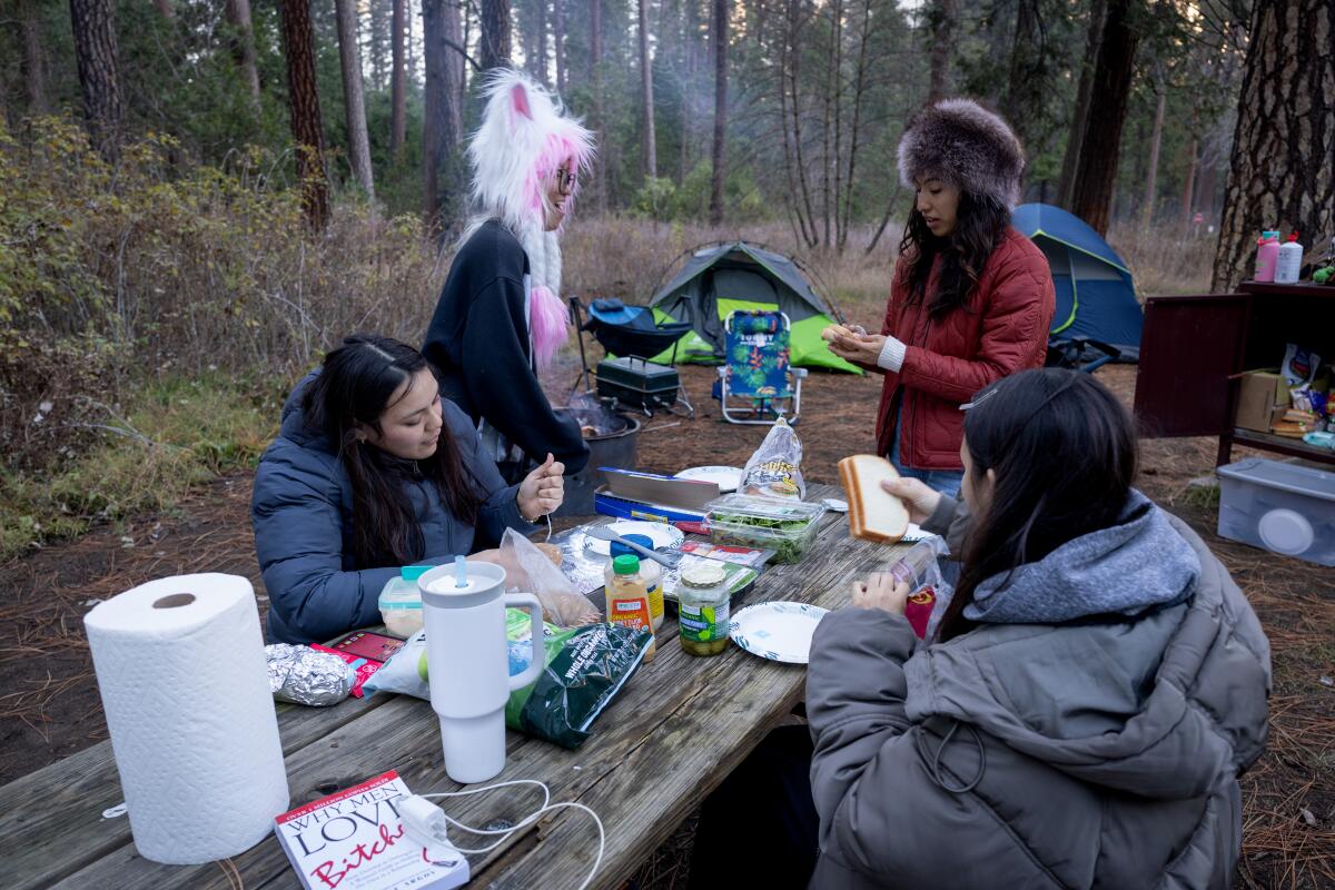 Campers prepare food in Yosemite Valley last December. 9, 2025 in Yosemite, CA.