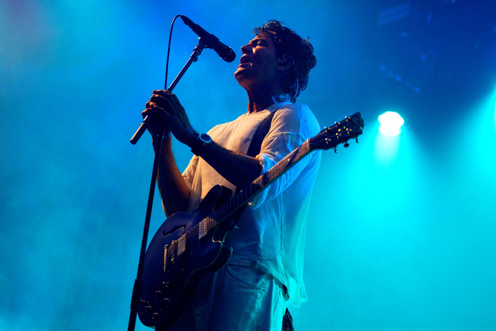 Stephan Jenkins onstage with a guitar.