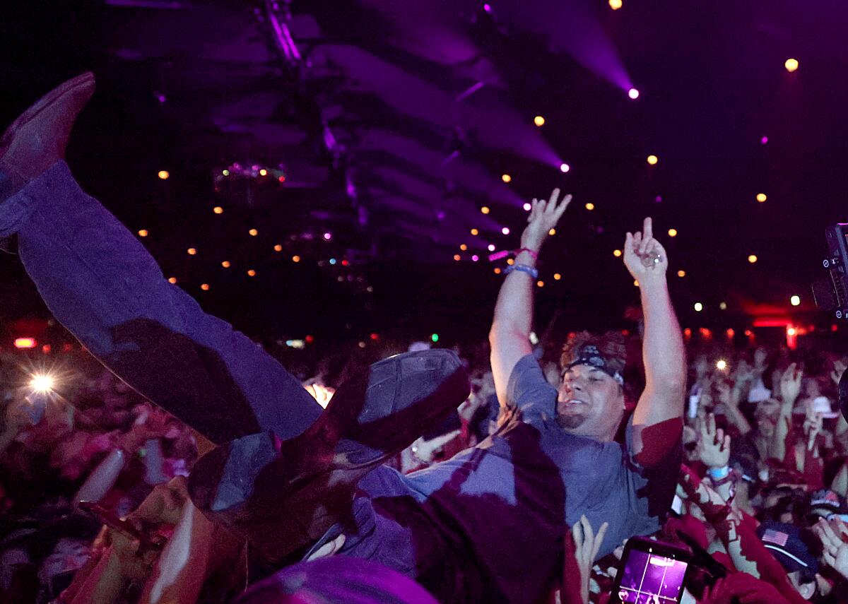  Theo Von crowd surfs in a tent