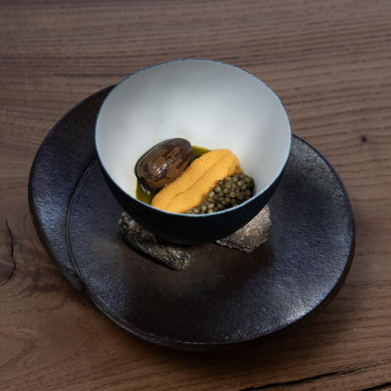 Sea urchin custard with an acorn and caviar.