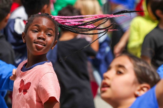 Mariah Clinton, 8, and her Rooftop Elementary School classmates follow moves by One Dance instructors during the Bay Area Dance Week kickoff event at Jesse Square in San Francisco, Friday, April 24, 2026. Bay Area Dance Week is a 10-day celebration of various dance styles held throughout the Bay Area. The One Dance performance included a Soul Line Dance class led by Oakland's Chocolate Platinum. (Ray Chavez/Bay Area News Group)