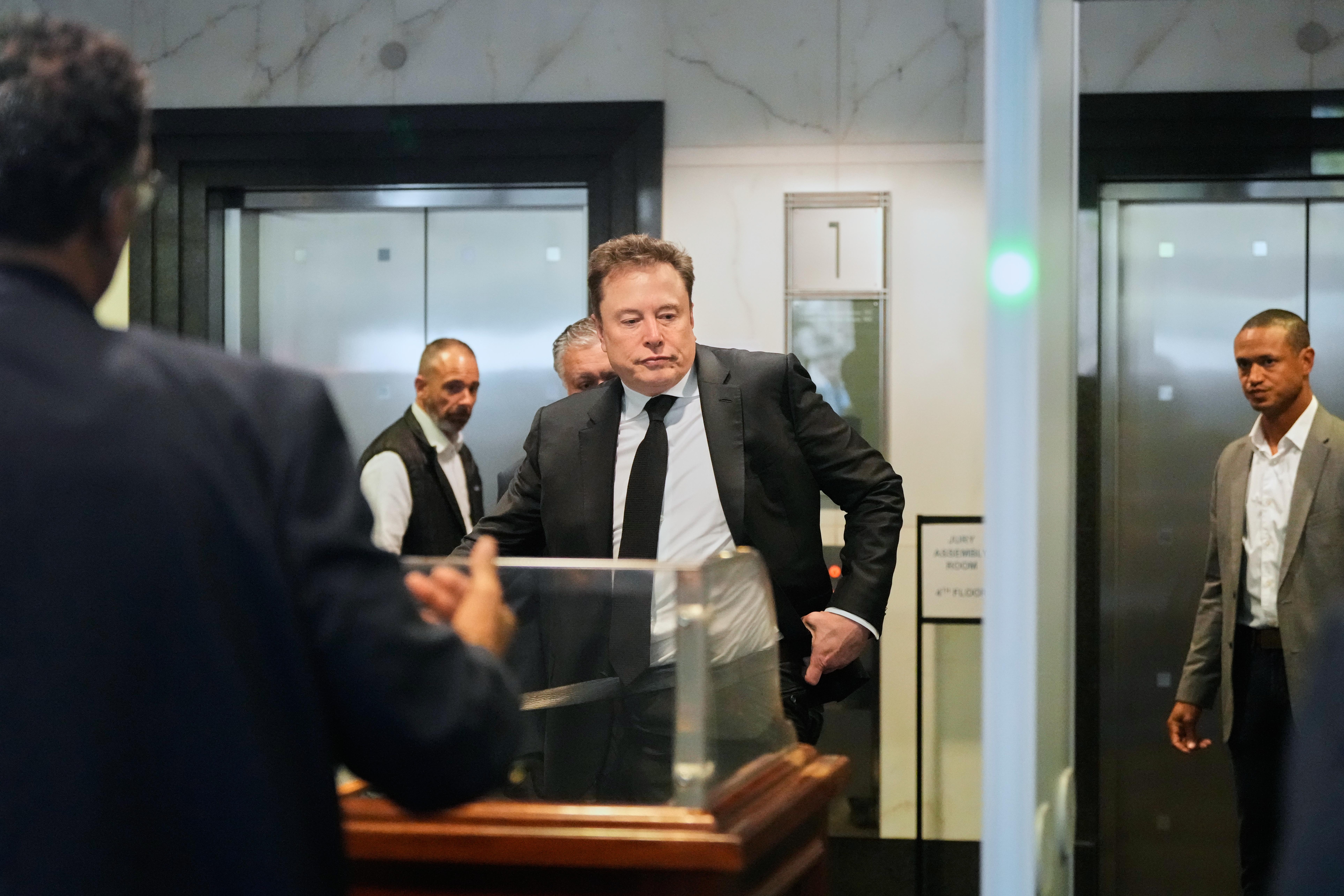 Elon Musk arrives at the U.S. District Court in Oakland,...